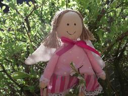 soft toy angel in the garden