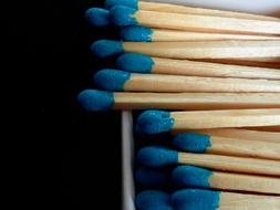 wooden matches with a blue tip