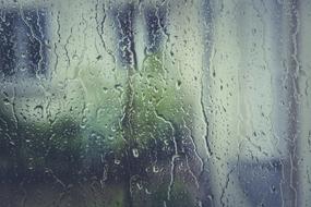 raindrops dripping down the window