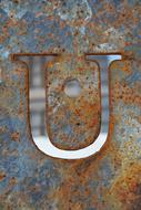 letter on a rusty background
