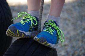 childrens feet in colored shoes