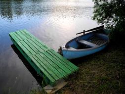 old wooden boat by the bridge
