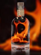 bottle of alcohol in front of the fire