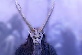 man in a mask with long horns