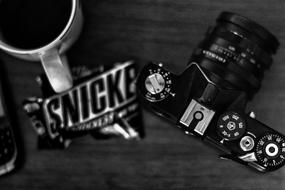black camera with a wrap