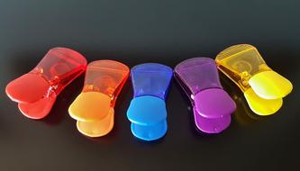 colored plastic clips on the table