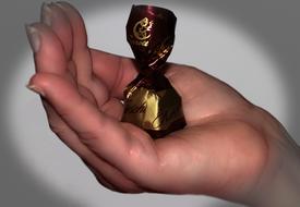candy in the hand of a girl