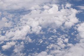 Weightless White Clouds High in the Blue Sky