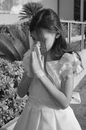 little girl in a dress praying