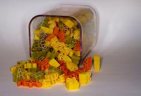 colored pasta sprinkled out of a can