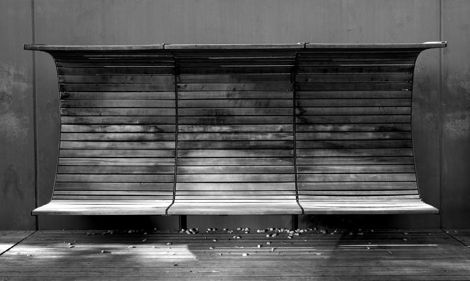 swirling bench against the wall