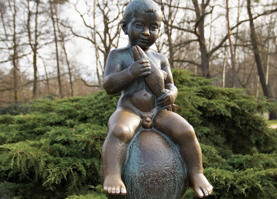 funny bronze sculpture of a boy