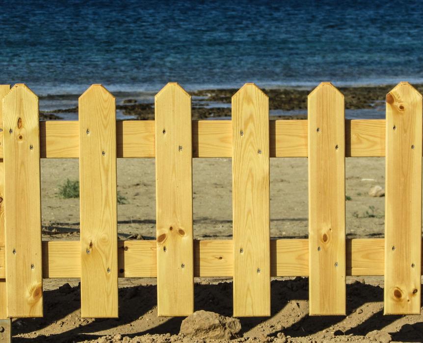 beautiful fence by the sea on the beach