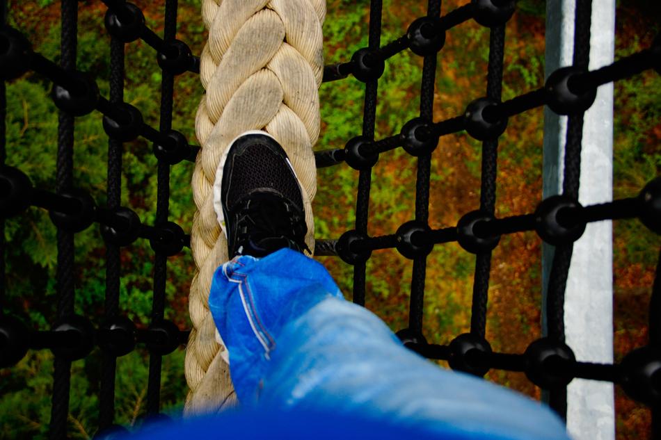the foot of a man in jeans