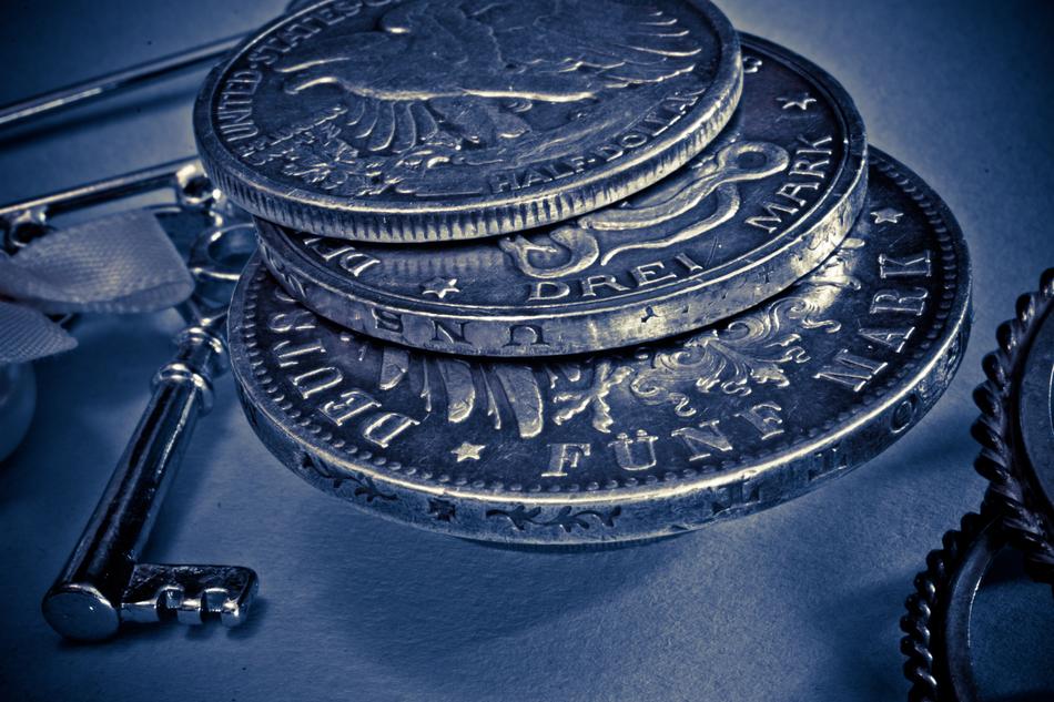 silver coin on a blue background