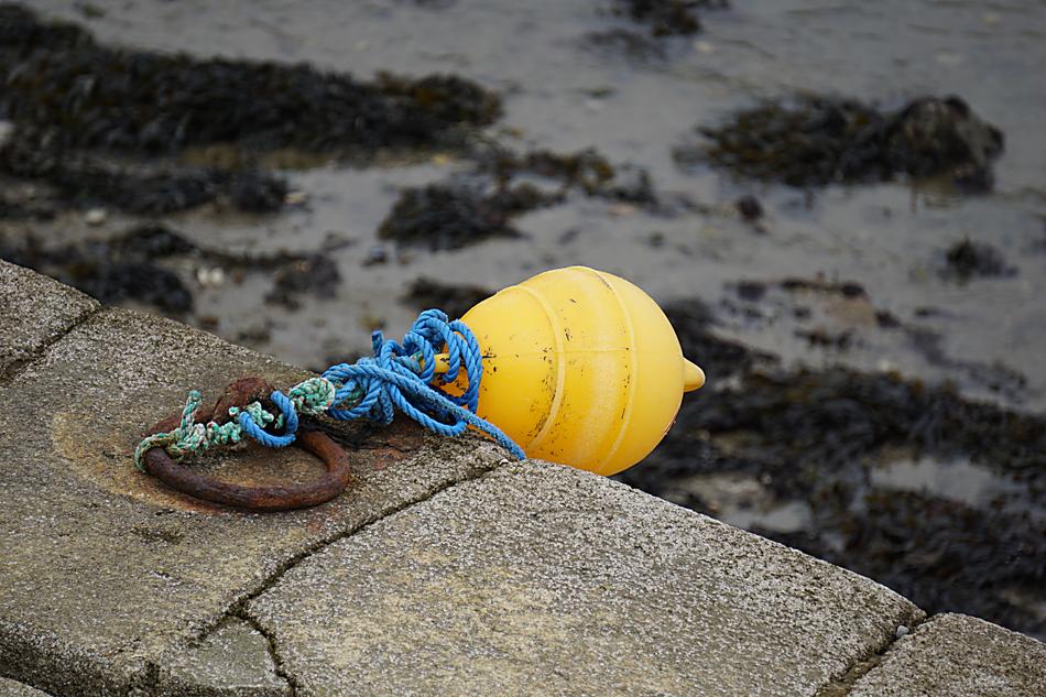 yellow float on the pier by the sea