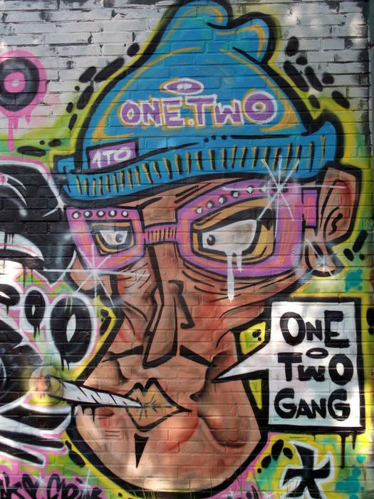 funny graffiti on a street wall