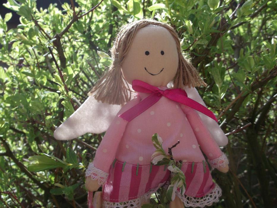 soft toy angel in the garden