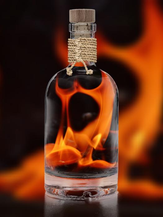 bottle of alcohol in front of the fire