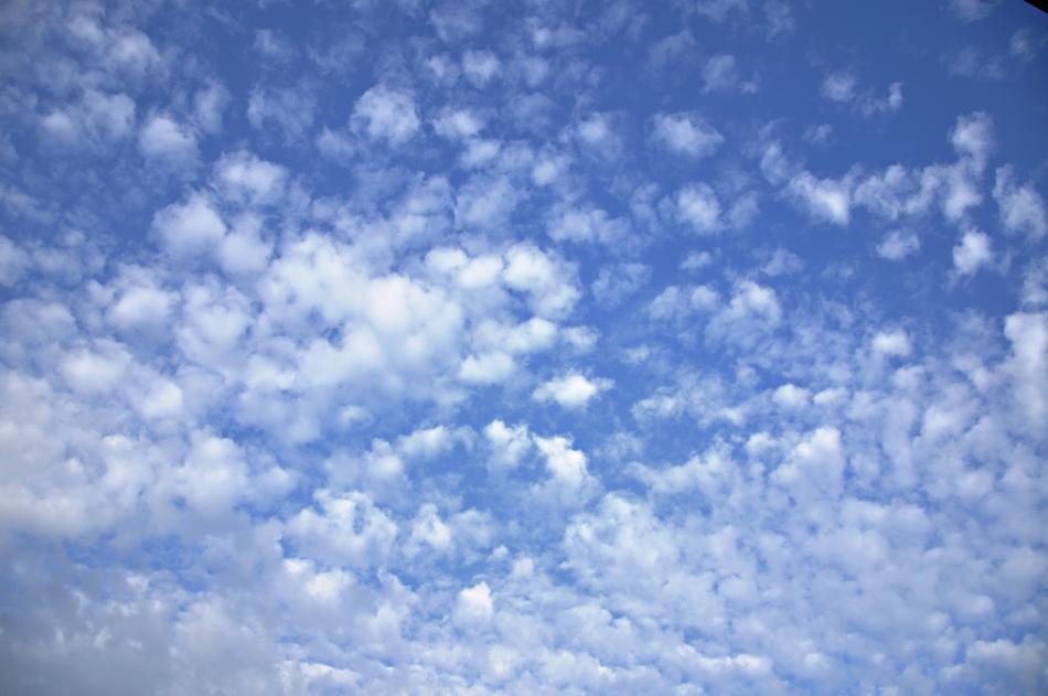 floating clouds in the blue sky