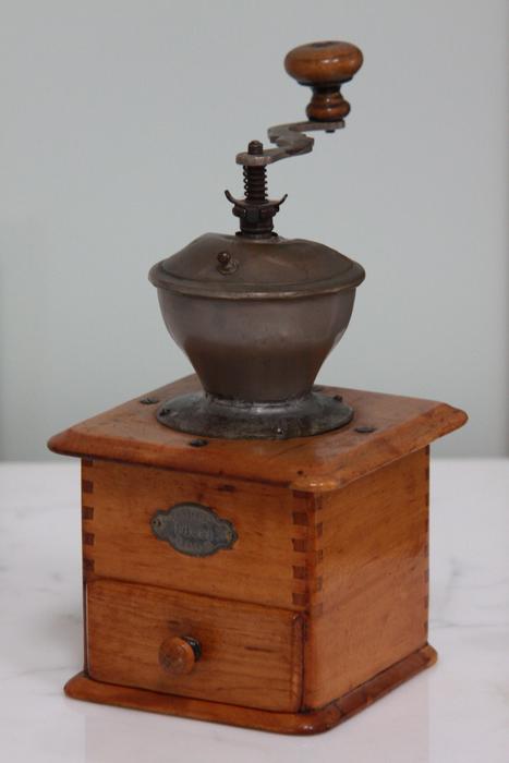 old coffee grinder against the wall
