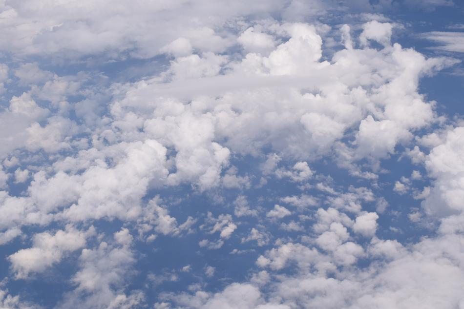 Weightless White Clouds High in the Blue Sky