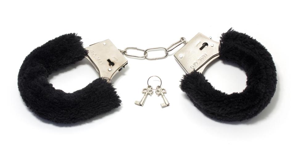 fluffy handcuffs on a white background