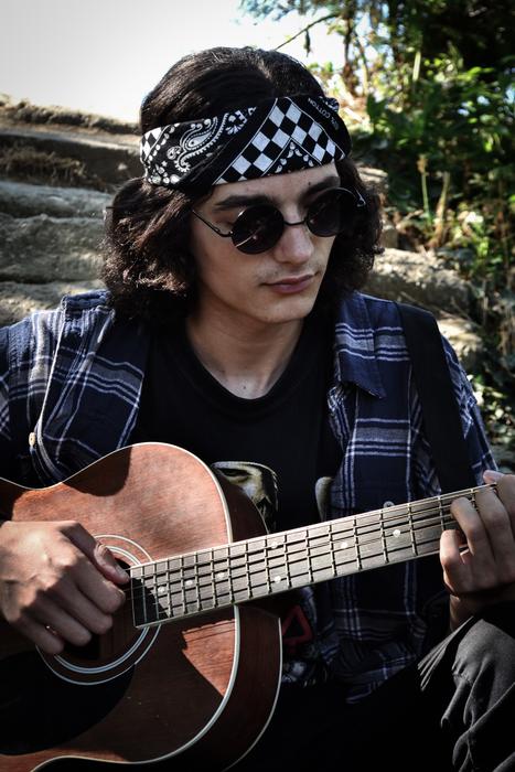 lonely guitarist with glasses