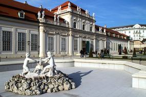 Fountain with sculptures by the castle