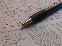 black pen on sudoku paper