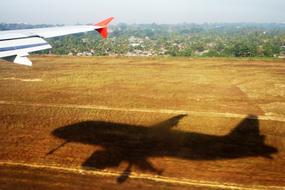 shadow of an airplane on the field