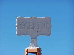 stone plaque on a blue background