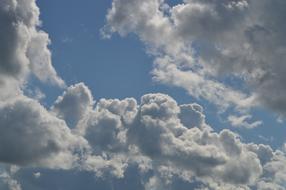 Light white clouds on a blue background
