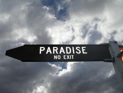 inscription on the sign against the sky