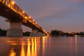 luminous stone bridge by the river