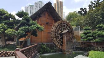 wooden house with a watermill