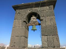 old bell tower in the stone arch