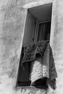 soft rug hanging from the window