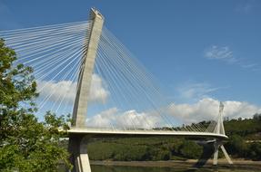 hinged white bridge over the river