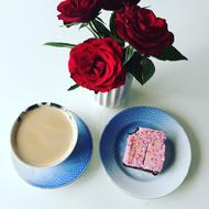 coffee with sweets near the flowers