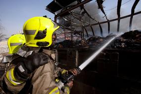 firefighters extinguish building fire