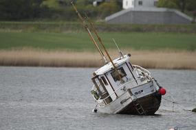 sinking boat in a lake