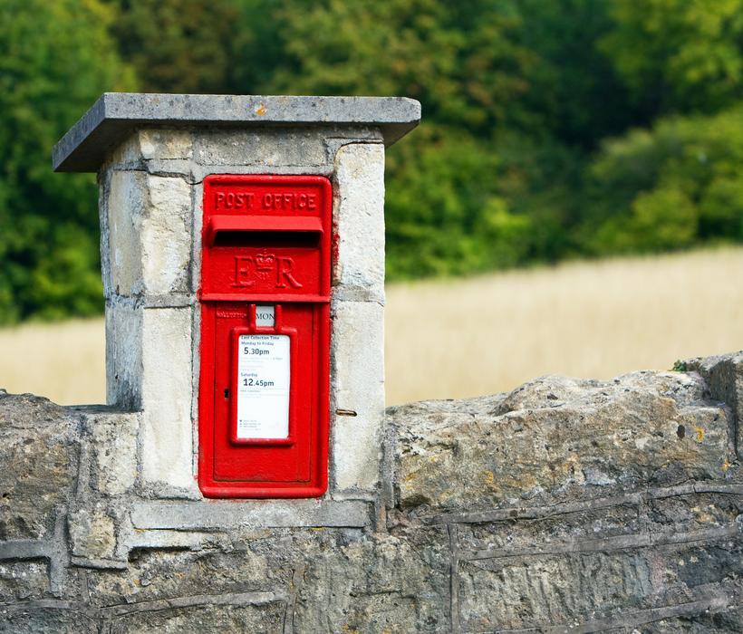 cute mailbox on the fence
