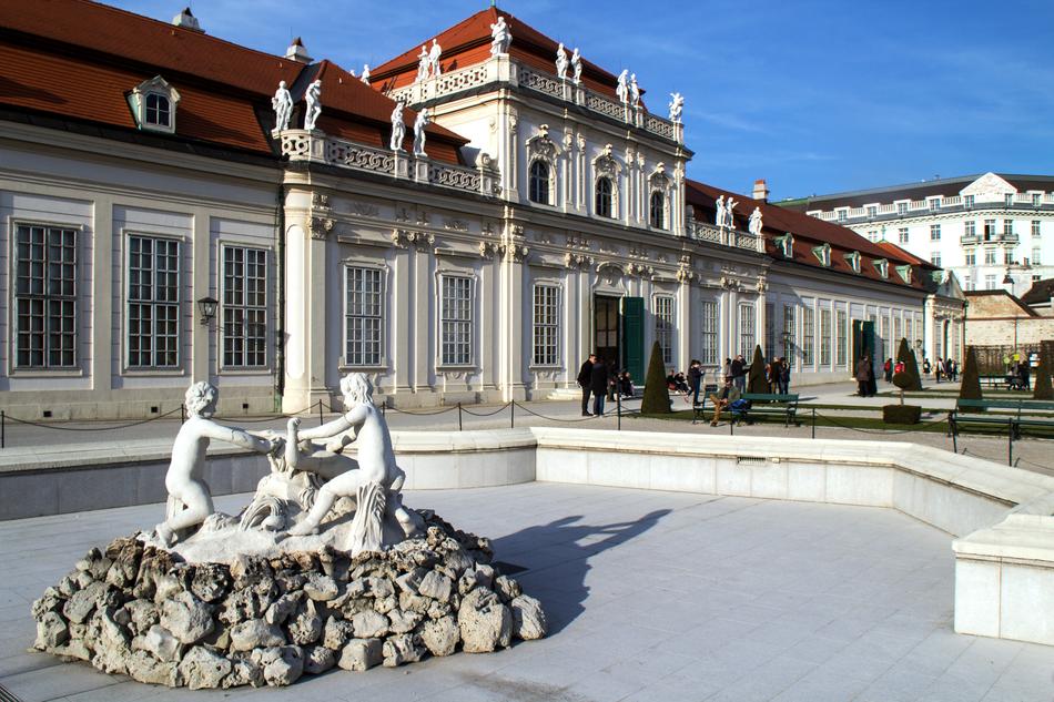 Fountain with sculptures by the castle