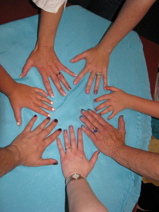 family hands on the table