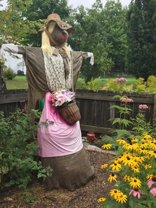 funny scarecrow with flower