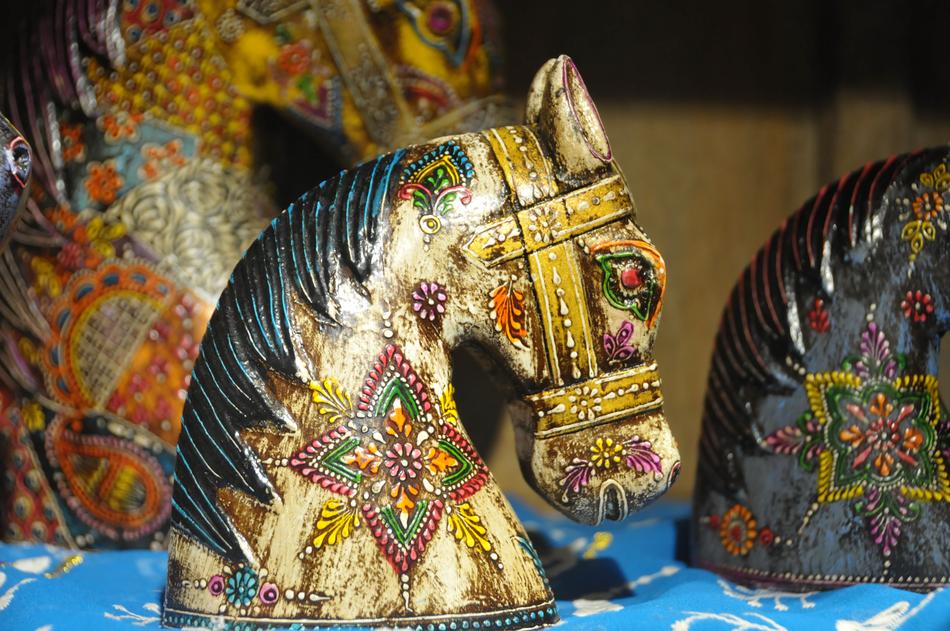 golden horse head with colored patterns