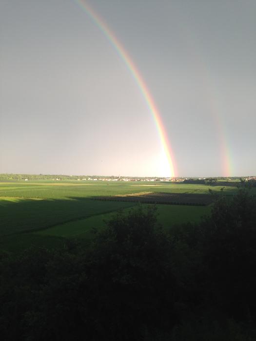 gorgeous big rainbow near the meadow