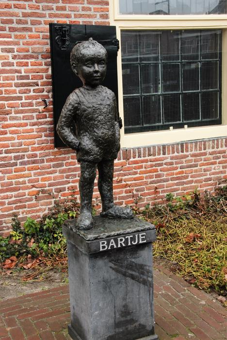 boy black stone statue