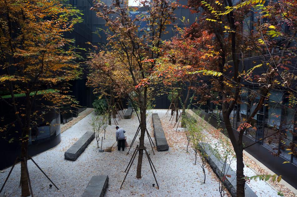 autumn garden with stone benches